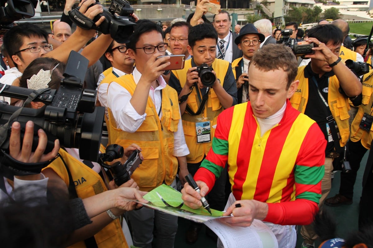 Ryan Moore surrounded by press after winning the 2016 Hong Kong Cup aboard Maurice. Photos: Kenneth Chan