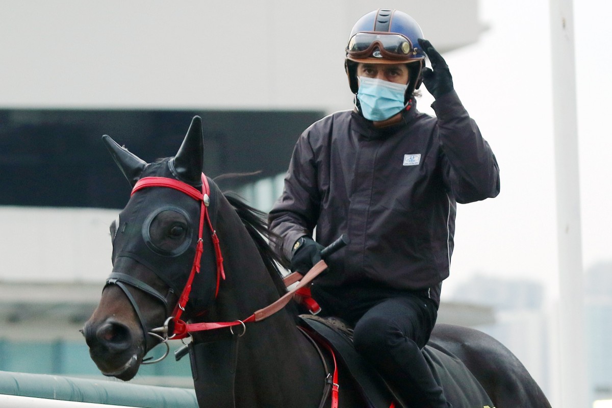 Christophe Soumillon waves to photographers at trackwork on Thursday morning. Photos: Kenneth Chan