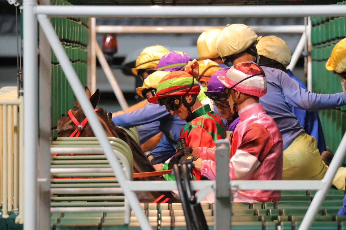 Jockeys line up to race at Happy Valley. Photos: Kenneth Chan