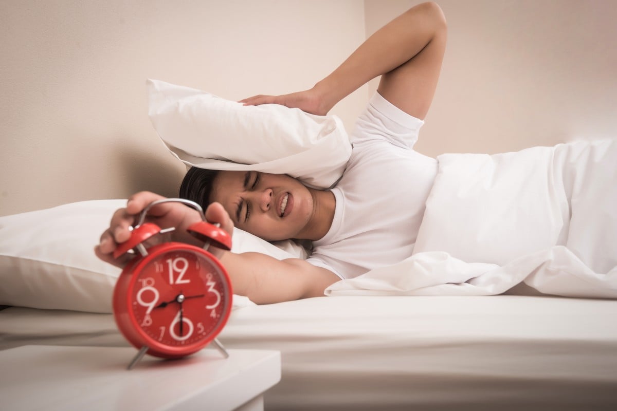 If you find yourself hitting the snooze button every day, you might want to rethink what time you go to bed.