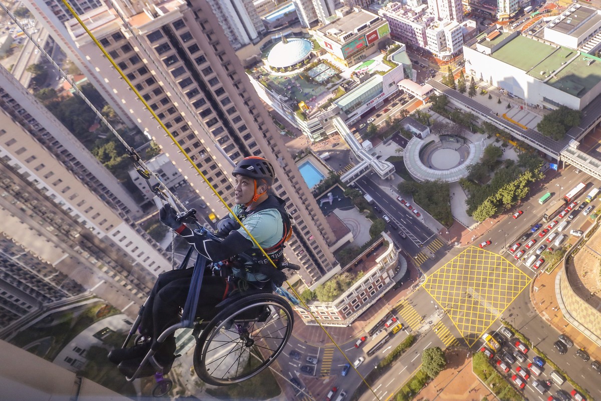 Lai Chi-wai pulled himself up hundreds of metres to raise funds for spinal cord patients in Hong Kong. Photo: SCMP / Dickson Lee