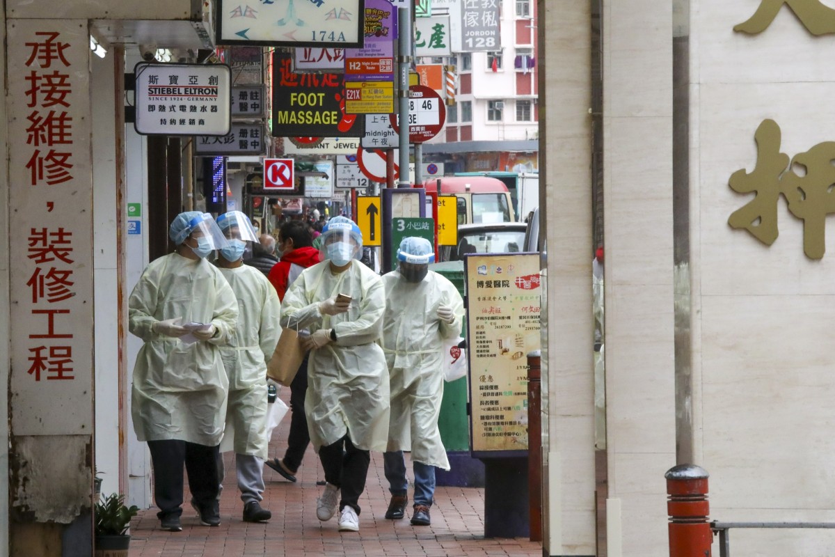 Health workers will administer mandatory tests to residents in parts of Yau Tsim Mong following a cluster of infections in the district. Photo: SCMP / K.Y. Cheng