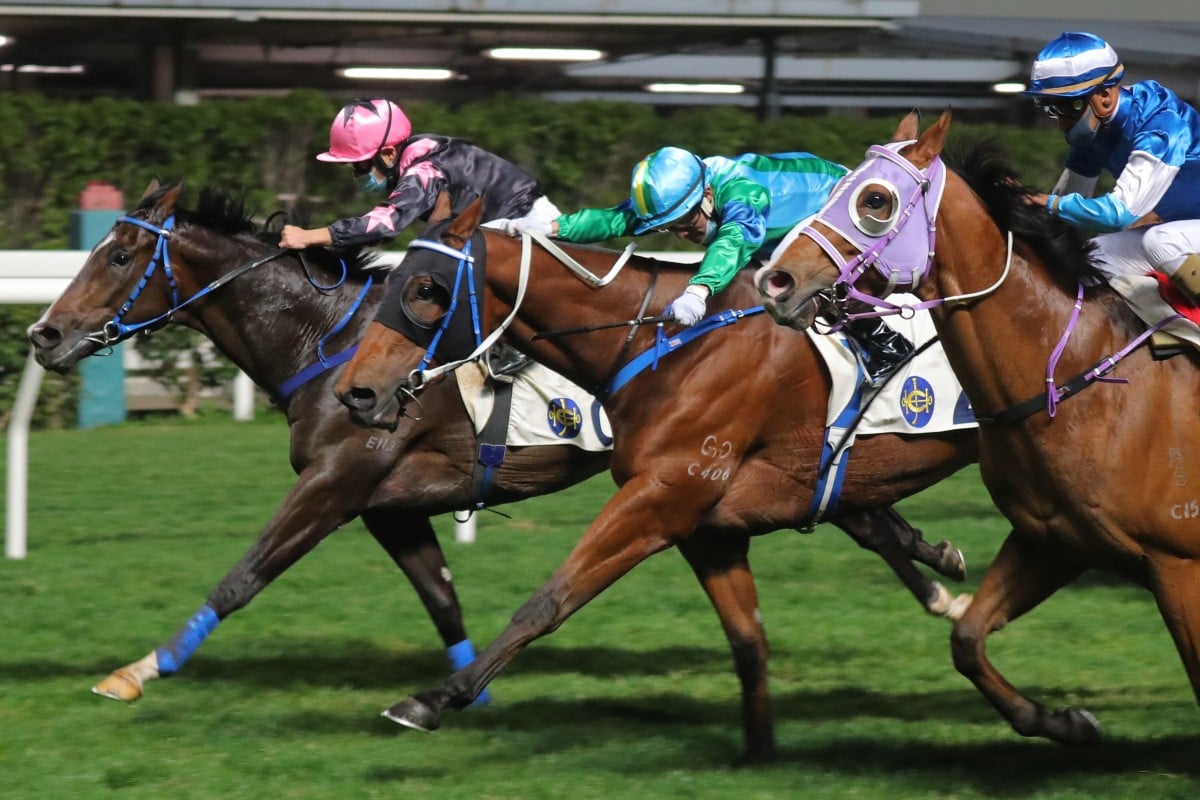 Keith Yeung drives The Anomaly (left) to victory at Happy Valley on Wednesday night. Photo: Kenneth Chan