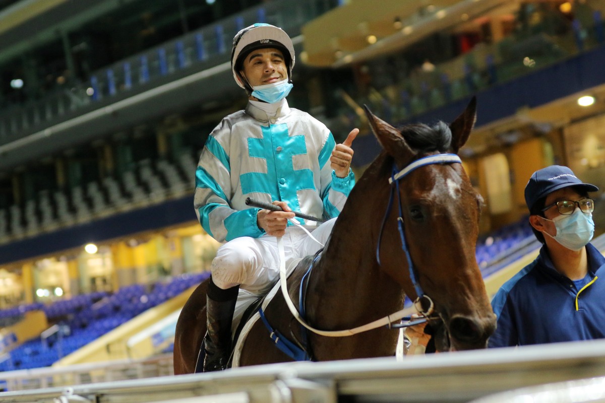 Joao Moreira gives the thumbs up after saluting aboard Daily Beauty at an empty Happy Valley on Wednesday night. Photos: Kenneth Chan