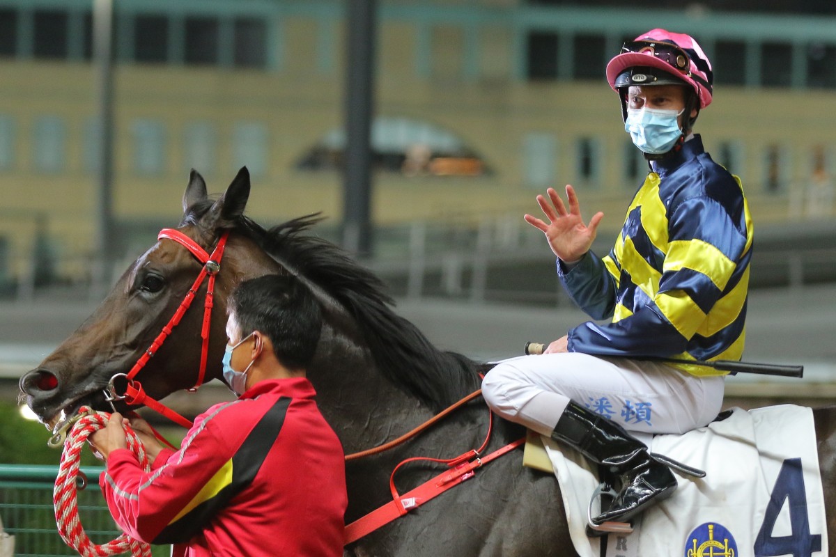 Zac Purton acknowledges his five winners after returning to scale aboard Wind N Grass. Photo: Kenneth Chan