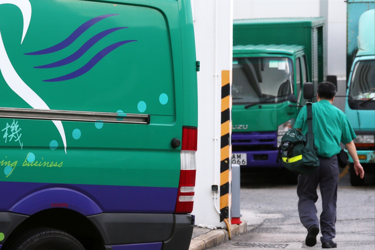 A postman at the General Post Office. Recently scammers pretending to be the post office have asked people for their credit card details and stolen the numbers. Photo: SCMP