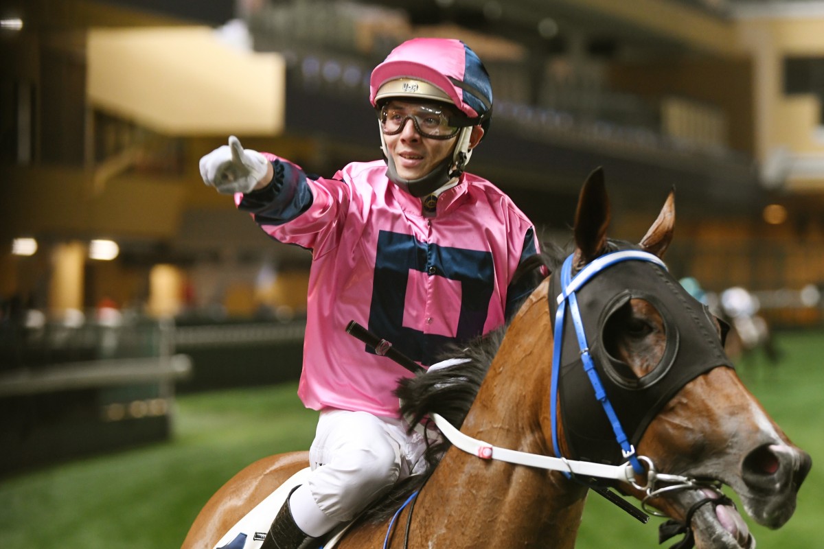 Alfred Chan enjoys his win aboard Land Power at Happy Valley on Wednesday night. Photos: Kenneth Chan