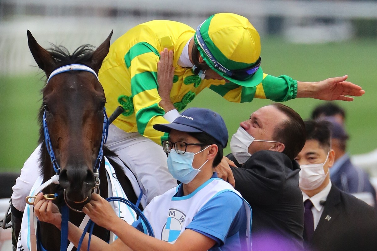 Caspar Fownes and Joao Moreira embrace after winning the BMW Hong Kong Derby with Sky Darci. Photos: Kenneth Chan