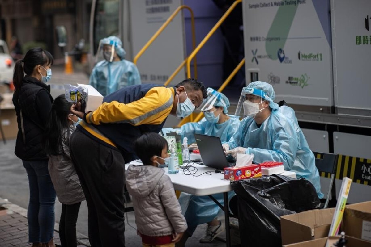 Members of Hong Kong’s ethnic minority community register for a Covid-19 test at one of the city’s mobile testing stations. Photo: EPA