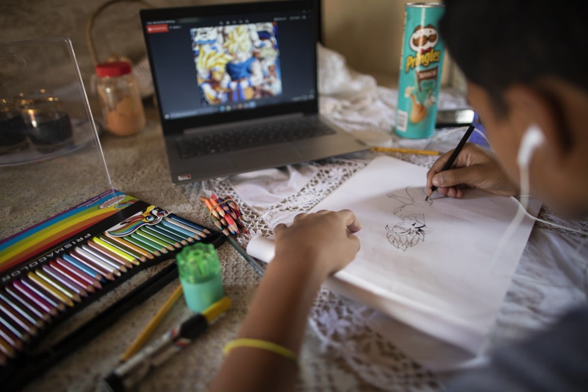 Samuel Andres Mendoza draws at his home, with the intention of selling it online, in Barquisimeto, Venezuela. In a country where workers earn an average of US$2 per month, the teen's drawings can make a big difference for a strained family budget. Photo: AP