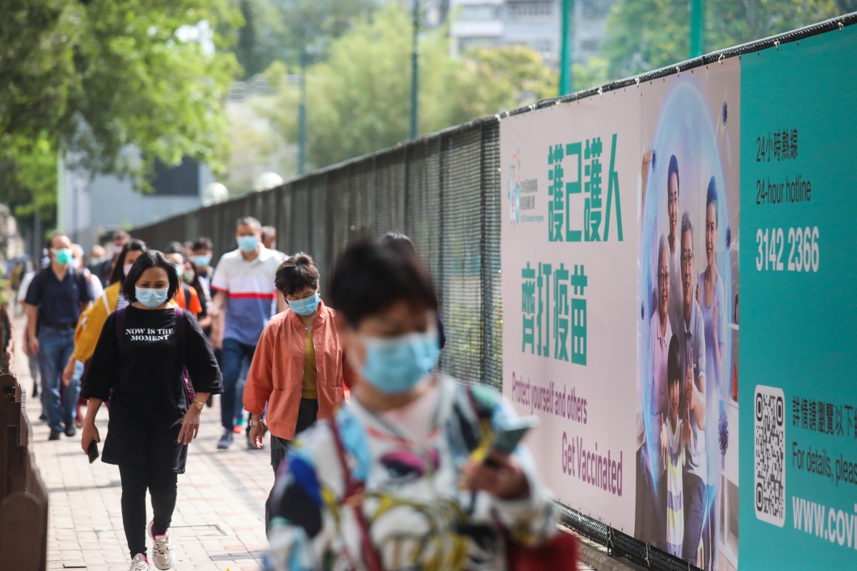 A poster in Causeway Bay encourages people to take the Covid-19 vaccine. Photo: SCMP/Xiaomei Chen