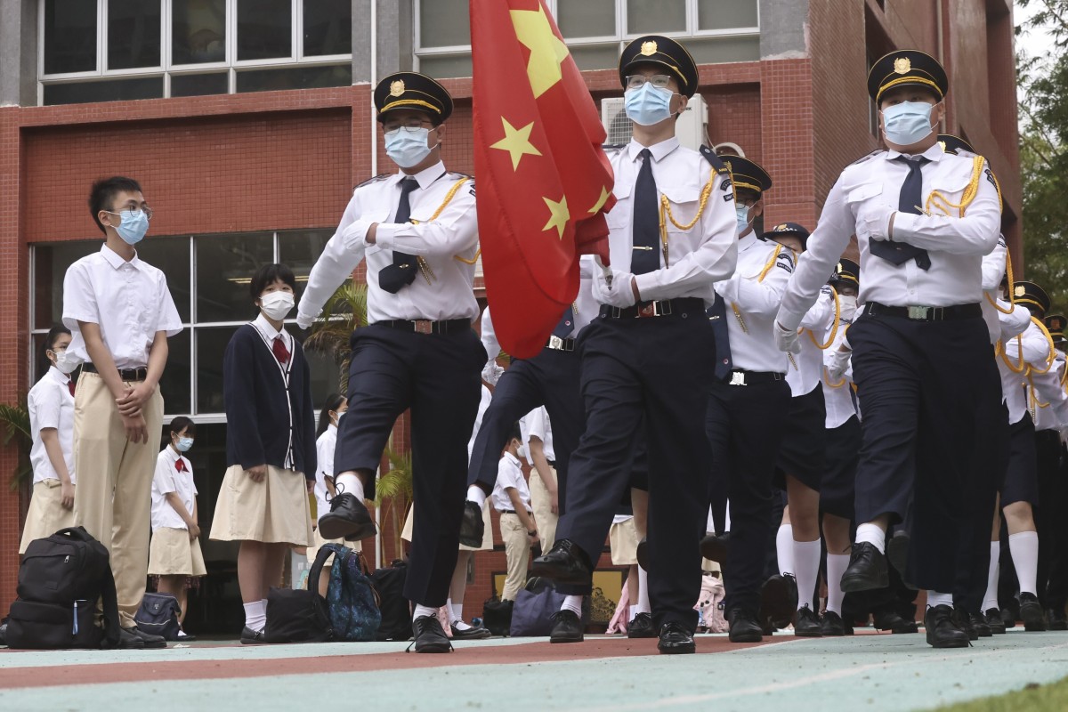 Flag raising at Gertrude Simon Lutheran College at Yuen Long during the National Security Education Day.SCMP / K. Y. Cheng