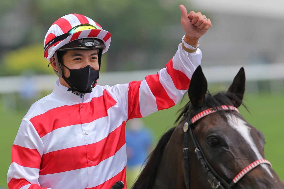 Derek Leung celebrates his victory aboard Love Me More at Sha Tin on Sunday. Photos: Kenneth Chan