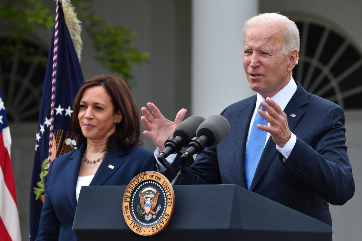 Vice President Kamala Harris looks on as President Joe Biden delivers remarks on the country’s Covid-19 response and vaccination programme. Photo: AFP/TNS
