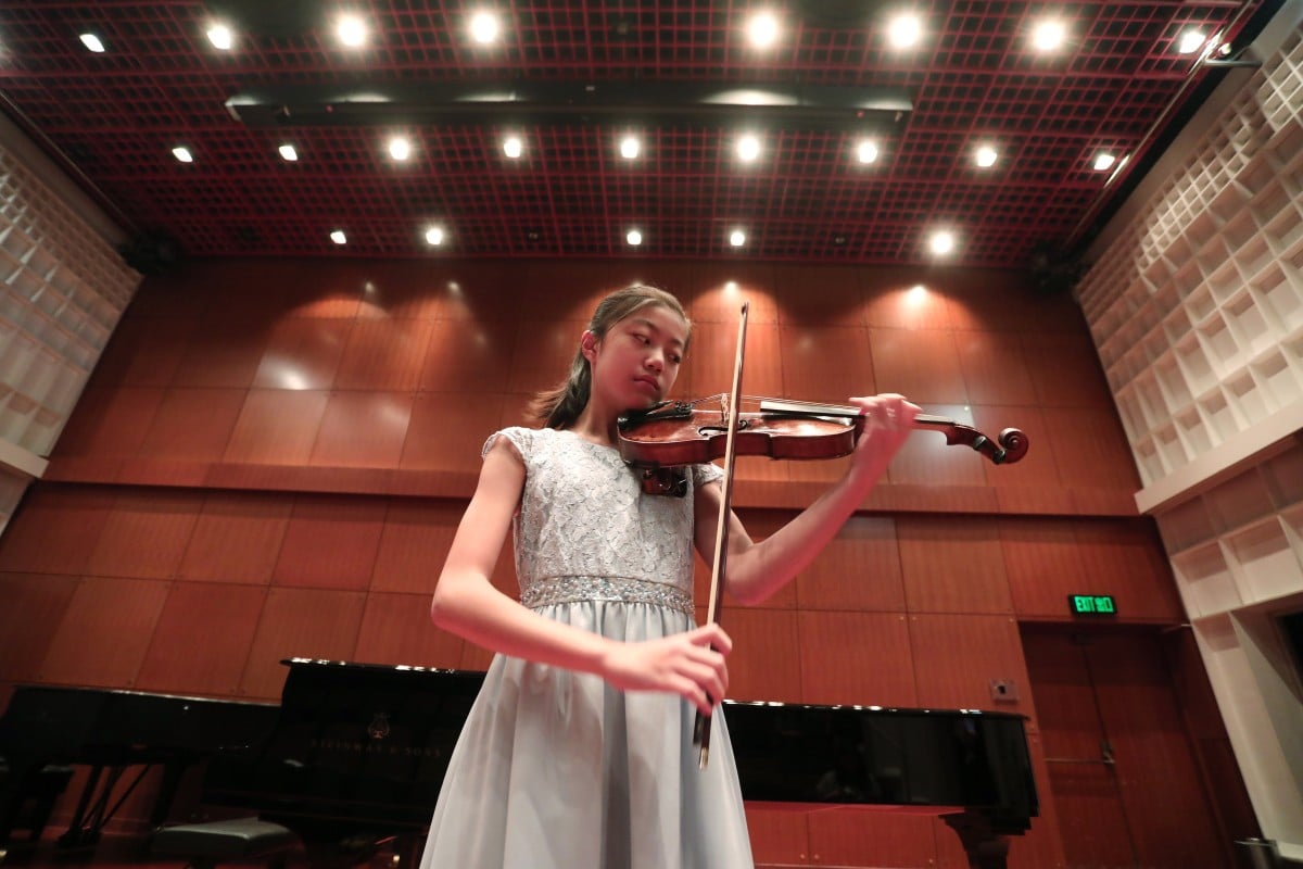 Violinist Hannah Tam Wan-ching plays her instrument at The Hong Kong Academy for Performing Arts (HKAPA) in Wan Chai. She was the youngest student worldwide to be admitted to the renowned Curtis Institute of Music in the US. Photo: SCMP/ Jonathan Wong