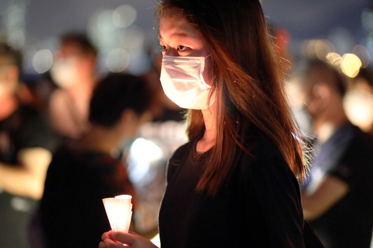 Although the official gathering in Victoria Park was cancelled last year because of the pandemic, some still met at the Kwun Tong Waterfront during the annual Tiananmen candlelight vigil. Photo: SCMP/ K. Y. Cheng