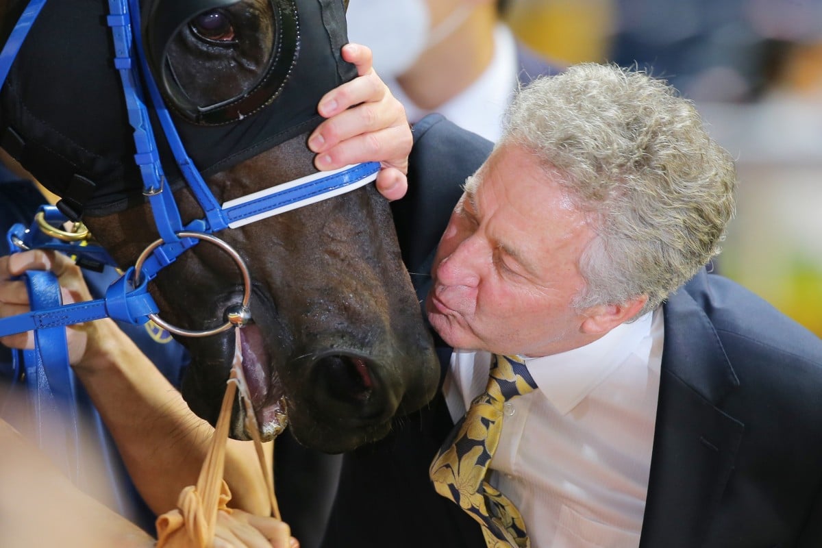 Trainer David Ferraris gives Nitro Express a kiss after a recent win. Photo: Kenneth Chan