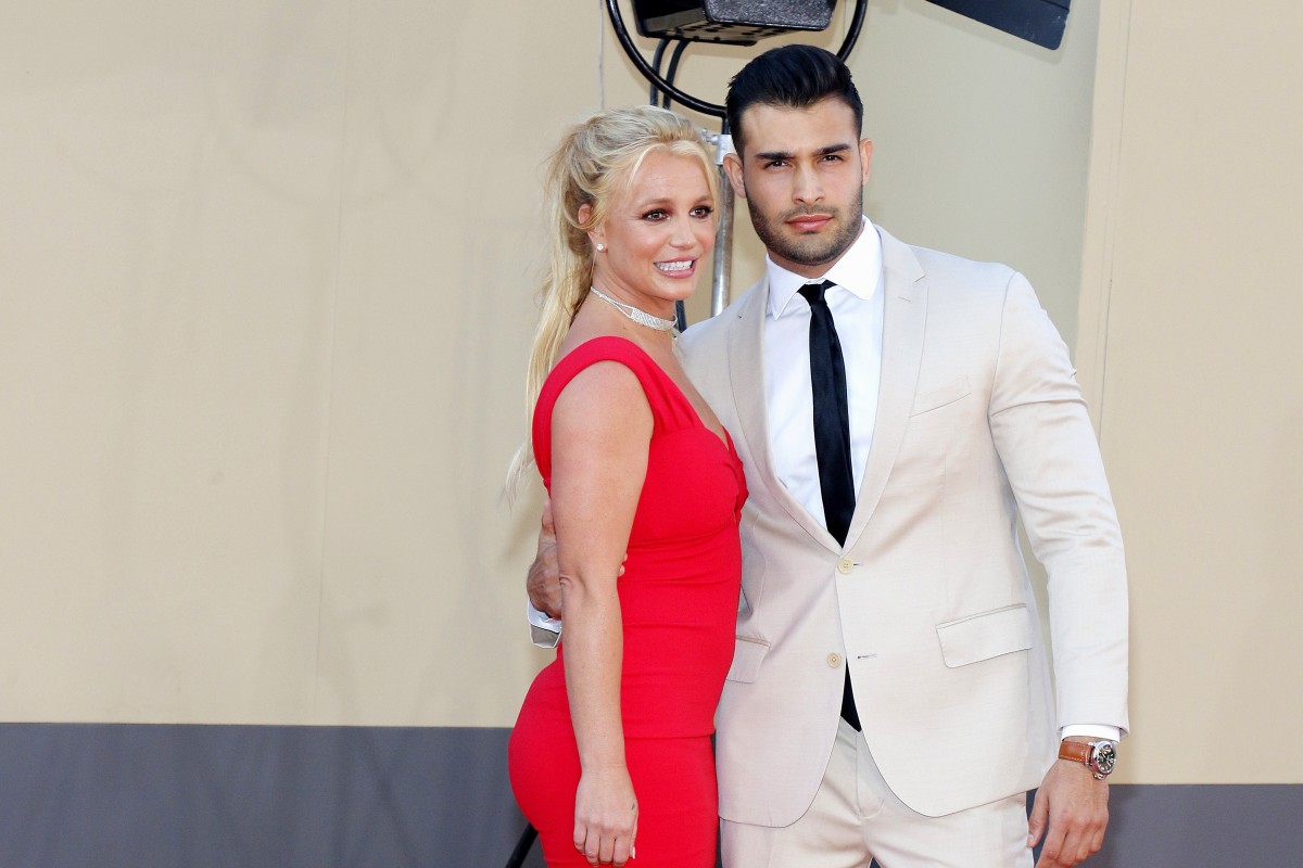 Britney Spears poses with her long time boyfriend Sam Asghari. She recently spoke out about the guardianship that's been controlling her life and finances for 13 years.