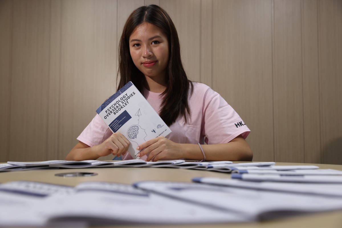 Spirit of Hong Kong Awards 2021 nominee Kristen Lei Tse-wing, a psychology student, poses with the Psychology Overseas Studies Booklet she published to promote mental health among students. Photo: SCMP/Nora Tam