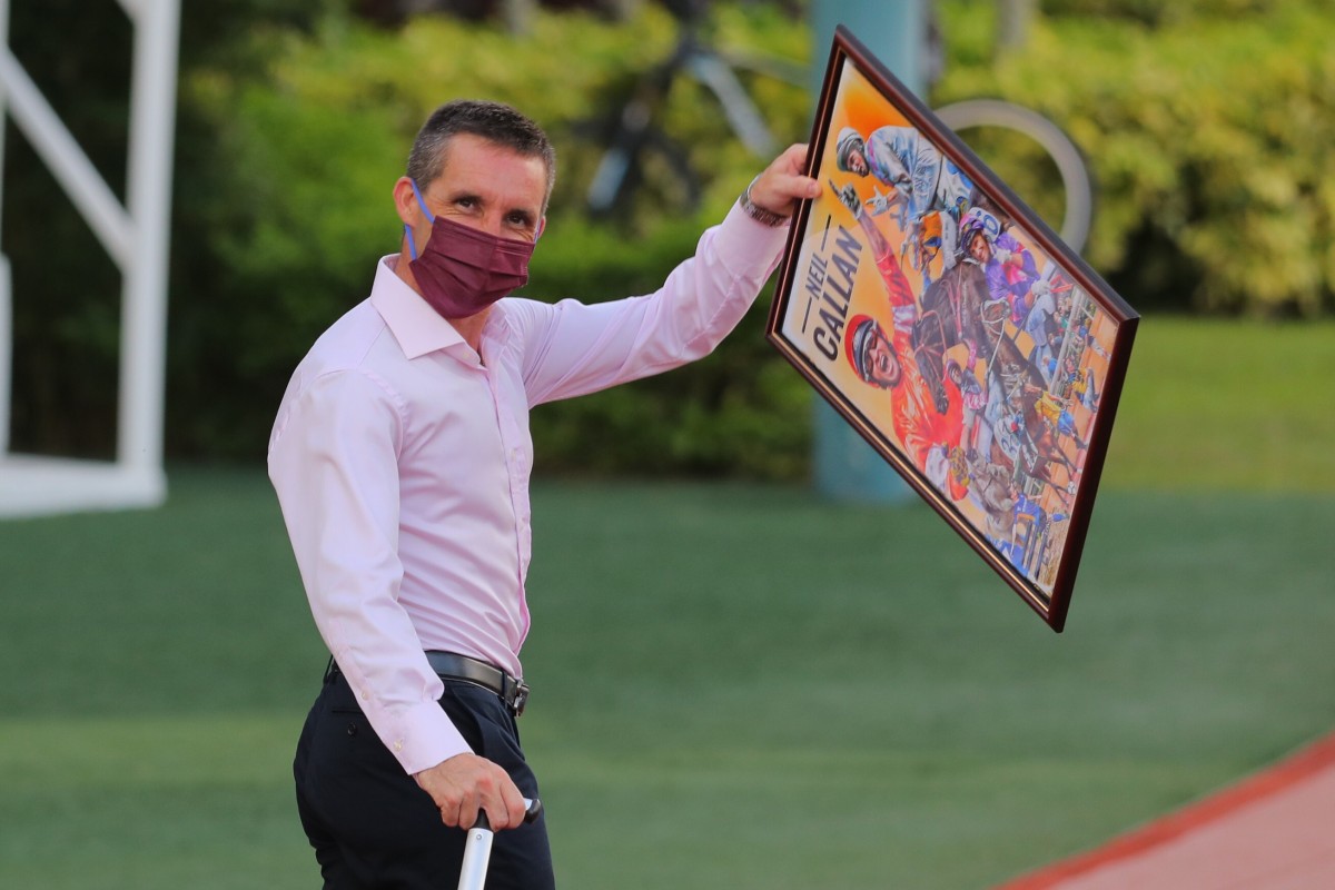 Jockey Neil Callan walks out of the races having being presented with a collage of his winners by members of the local press. Photos: Kenneth Chan