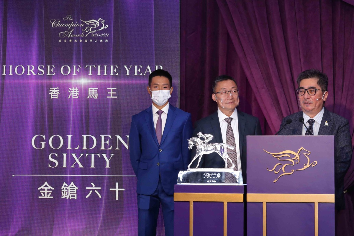 Jockey Vincent Ho, trainer Francis Lui and Golden Sixty's owner Stanley Chan collect the Horse of the Year title. Photo: HKJC