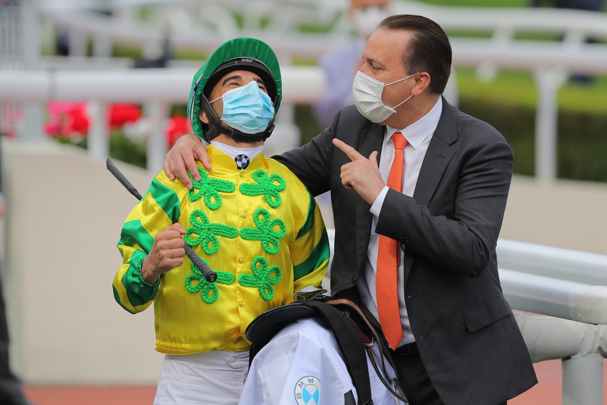 Jockey Joao Moreira and trainer Caspar Fownes celebrate their Derby win with Sky Darci in March. Photo: Kenneth Chan