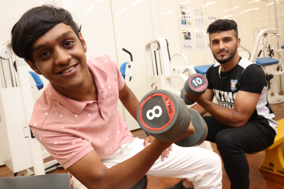 Two DSE candidates this year, Muhammad Abdullah Khan (from left) and Ajab Khan, want to become physical education teachers in the future. Photo: SCMP / May Tse