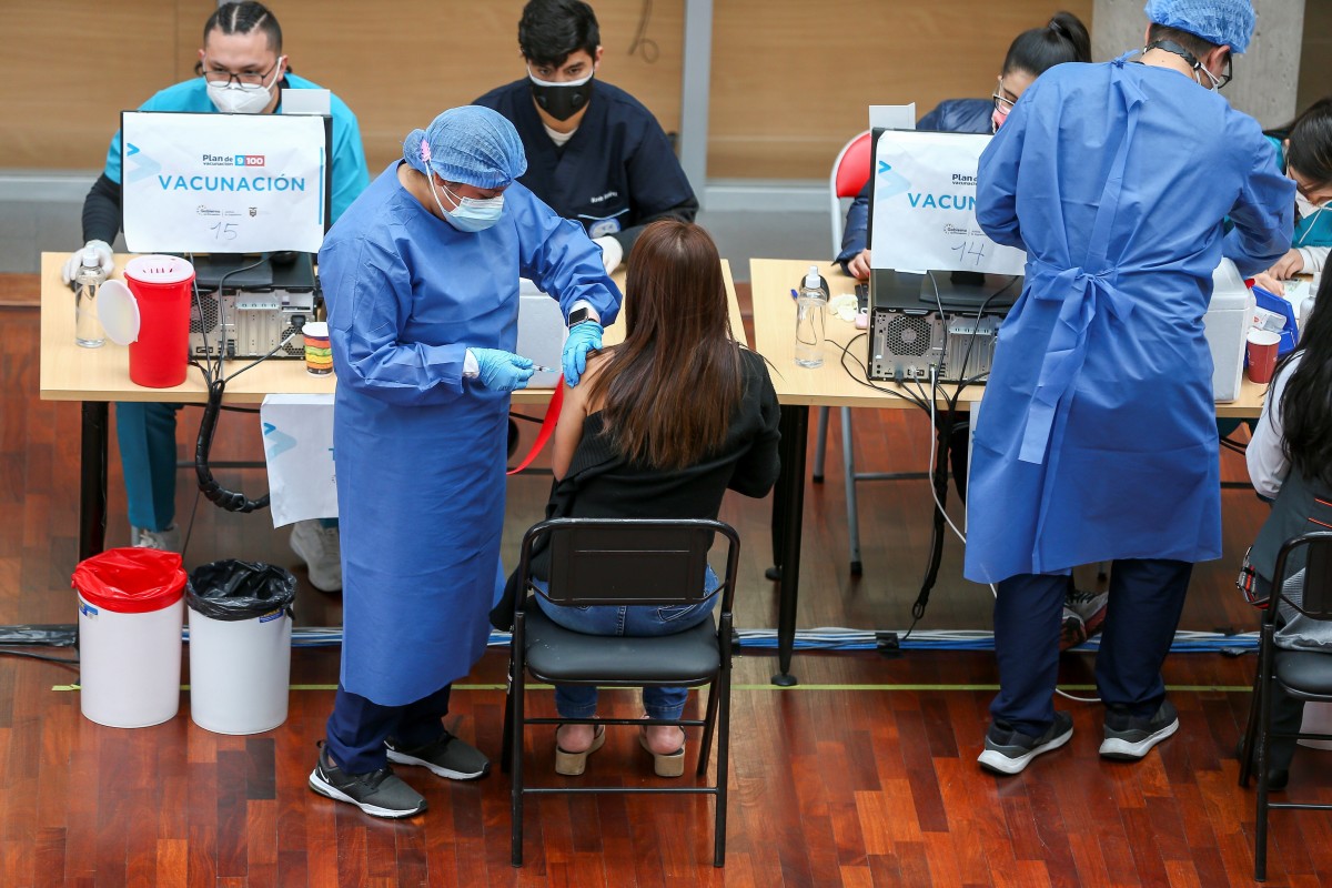 A person receives a dose of the vaccine against Covid-19 at the University of Las Americas in Quito, Ecuador. The Ecuadorian government aims to vaccinate nine million people, equivalent to 60 per cent of the population, by the end of August. Photo: EPA
