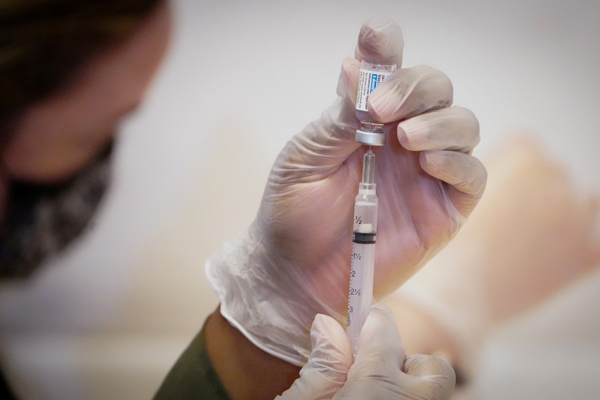 A healthcare worker prepares a dose of the Johnson & Johnson coronavirus vaccine during the opening of a public vaccination programme in New York City. Photo: Reuters