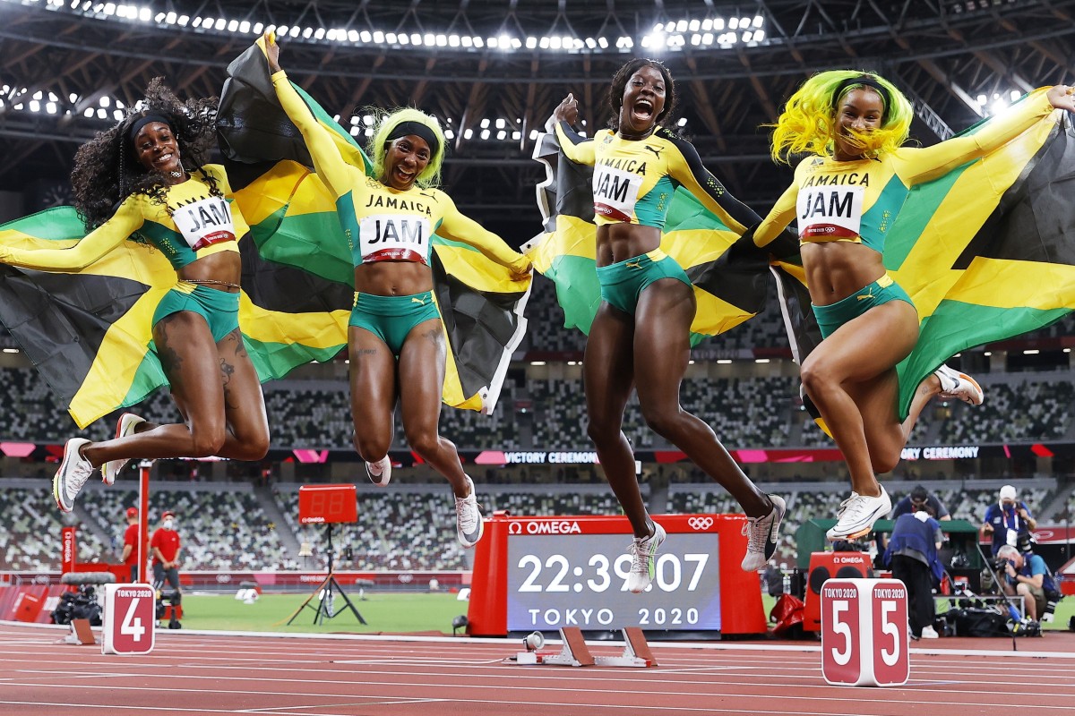 From left: Jamaican athletes Elaine Thompson-Herah, Shelly-Ann Fraser-Pryce, Shericka Jackson and Briana Williams celebrate after winning the Women's 4x100m Relay final of the Athletics events in Tokyo. Photo: EPA