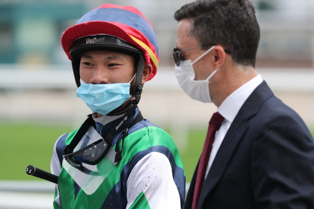 Jerry Chau talks to his boss Douglas Whyte after their win on Sunday. Photo: Kenneth Chan