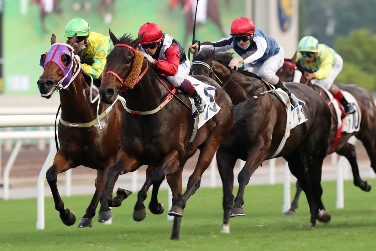 Trillion Win (red sleeves) salutes as Naboo Attack (blue and white silks) surges to the line for second. Photos: Kenneth Chan