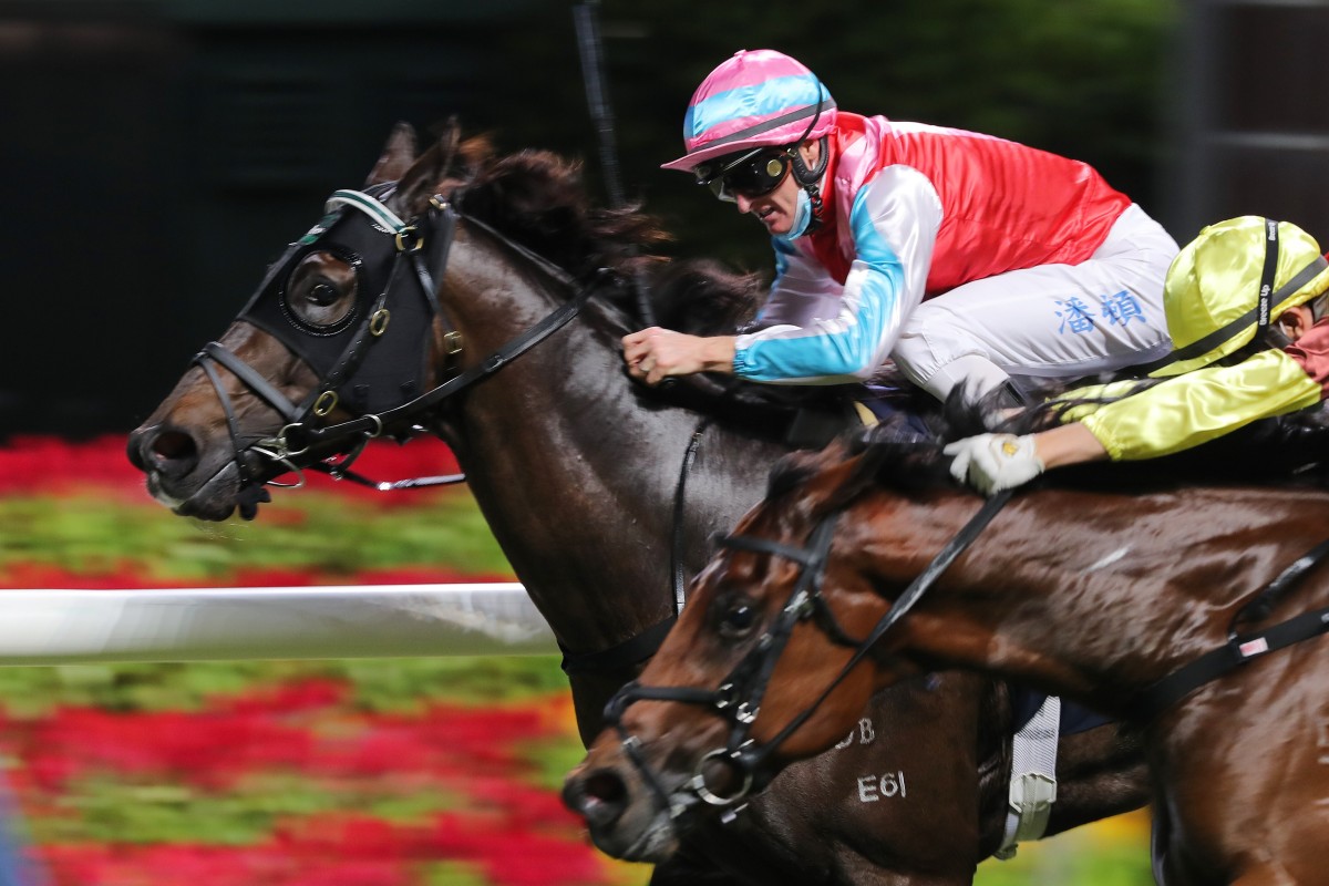 Zac Purton salutes aboard Harmony N Blessed on his way to four winners at Happy Valley on Wednesday night. Photo: Kenneth Chan
