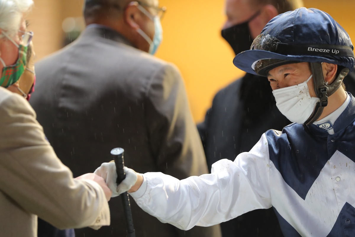 Jerry Chau is all smiles as he celebrates Sacred Ibis’ victory with connections. Photos: Kenneth Chan