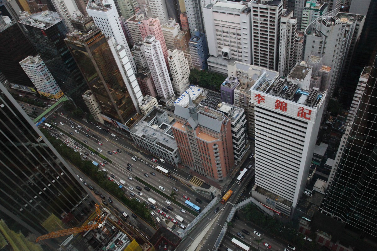 View of traffic on Gloucester Road and Wan Chai from the Sky Lobby, 46 floors up Central Plaza.
