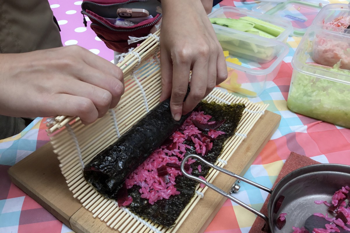 Roll, roll, roll the sushi roll – but make sure it’s nice and tight when you do!