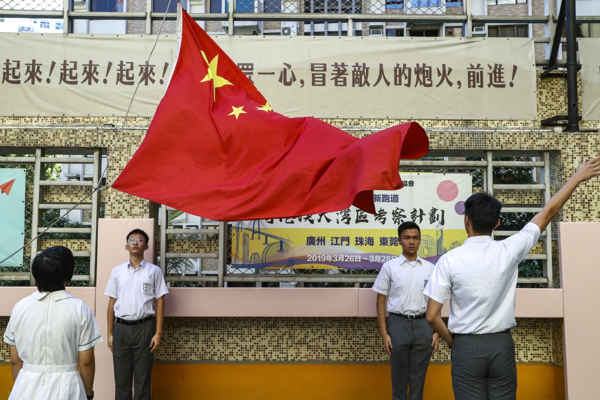 The flag-raising ceremony has been performed for years in local schools to celebrate National Day.