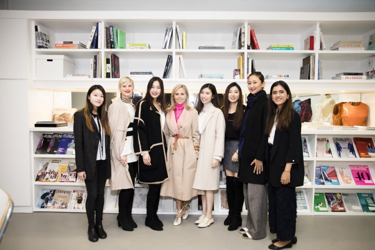 Fashion designer Tory Burch poses with students at SCAD Hong Kong.