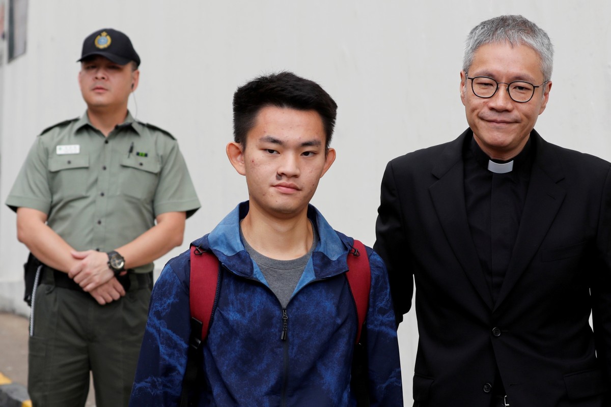 Chan Tong-kai, with Reverend Canon Peter Koon, after his release yesterday.