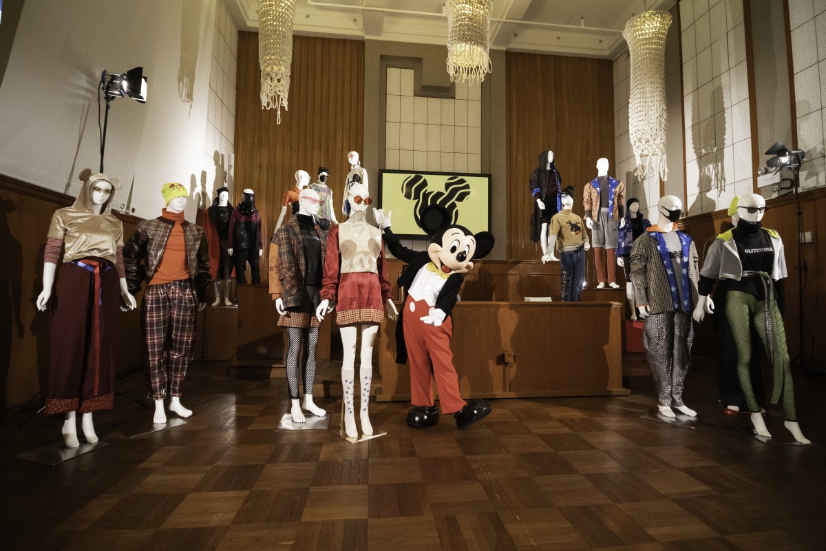 Mickey Mouse poses with the 16 streetwear looks inspired by him and designed by SCAD Hong Kong students.