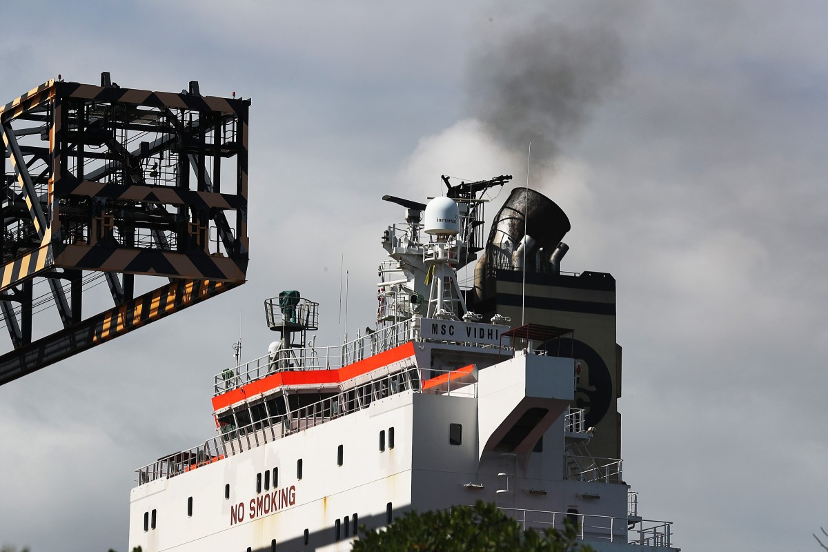 Smoke is seen pouring from the smoke stack on a container ship at Port Everglades on November 05, 2019 in Fort Lauderdale, Florida.