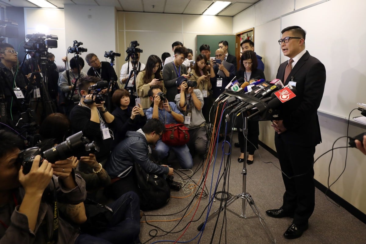 Police chief Chris Tang greets the media at a Central and Western District Council meeting.