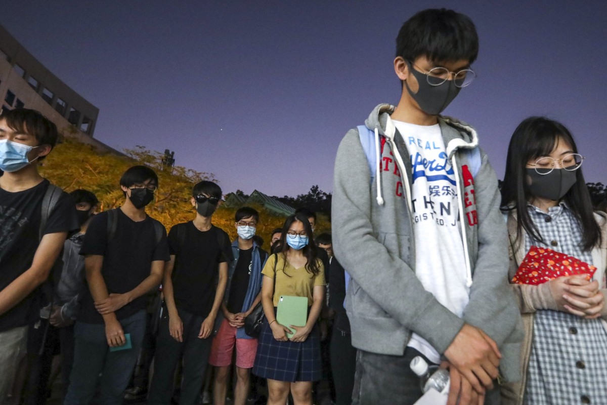 Students pray for Chow Tsz-Lok, who suffered severe brain injury in a fall in a car park in Tseung Kwan O.