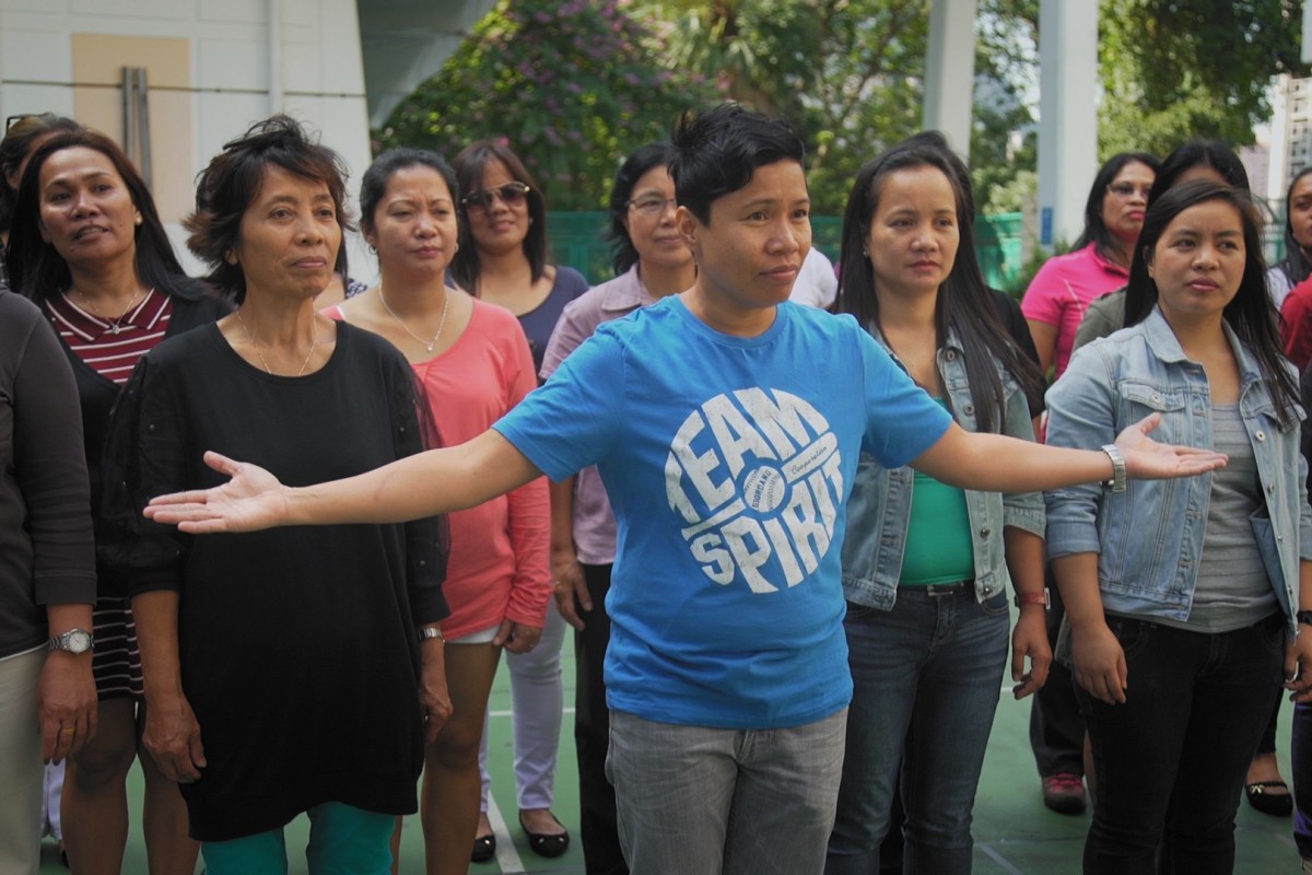 A choir of domestic helpers rehearsing for Clockenflap 2015 shows some of the personal achievements domestic workers can have while far from home.