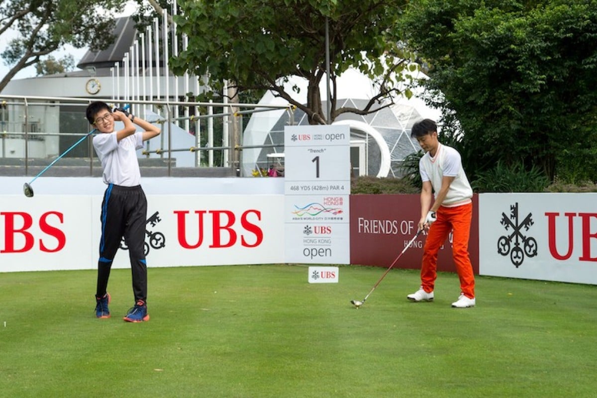 Tsang Tsz-ho (left) with Hacken Lee at the UBS Hong Kong Open Charity Cup.