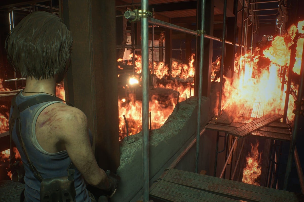Jill Valentine runs through a burning building trying to escape Nemesis in the "Resident Evil 3" remake.