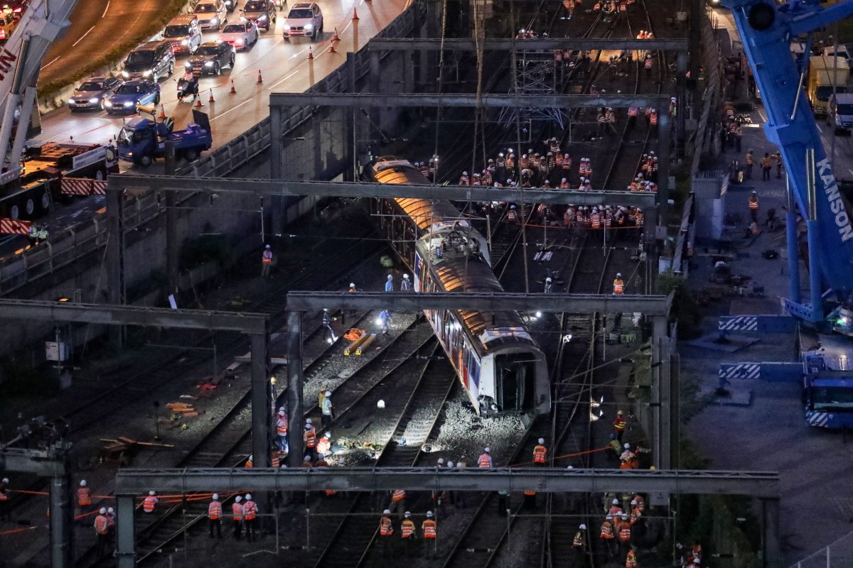 MTR staff worked overnight to remove the wreckage of the derailed train near Hung Hom station. Photo: Felix Wong