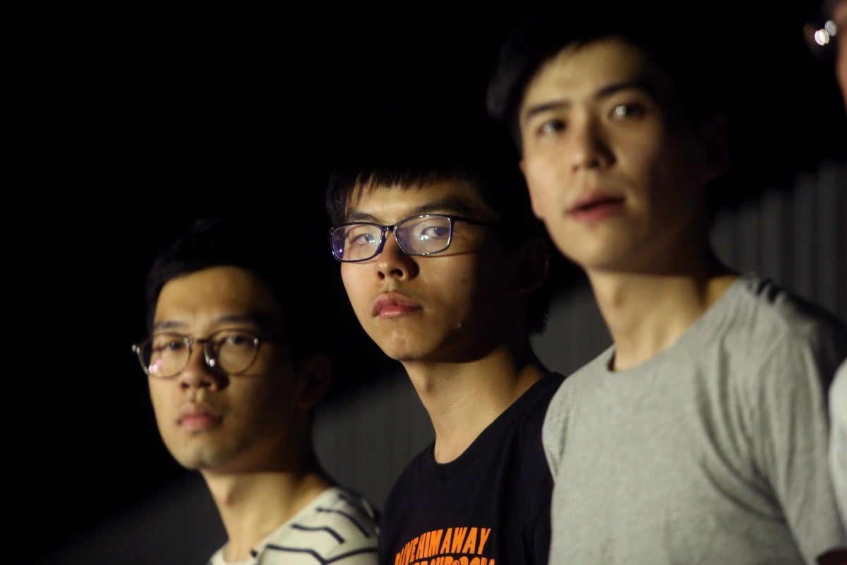 (From left) Nathan Law Kwun-chung, Joshua Wong Chi-fung and Lester Shum attend a protest in support of 13 protesters who were jailed on Tuesday.