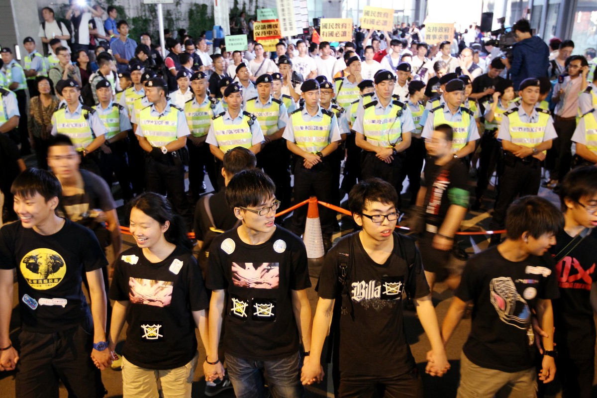 Police officers stand guard outside Central Government Offices in Tamar during national education forum. 17OCT12