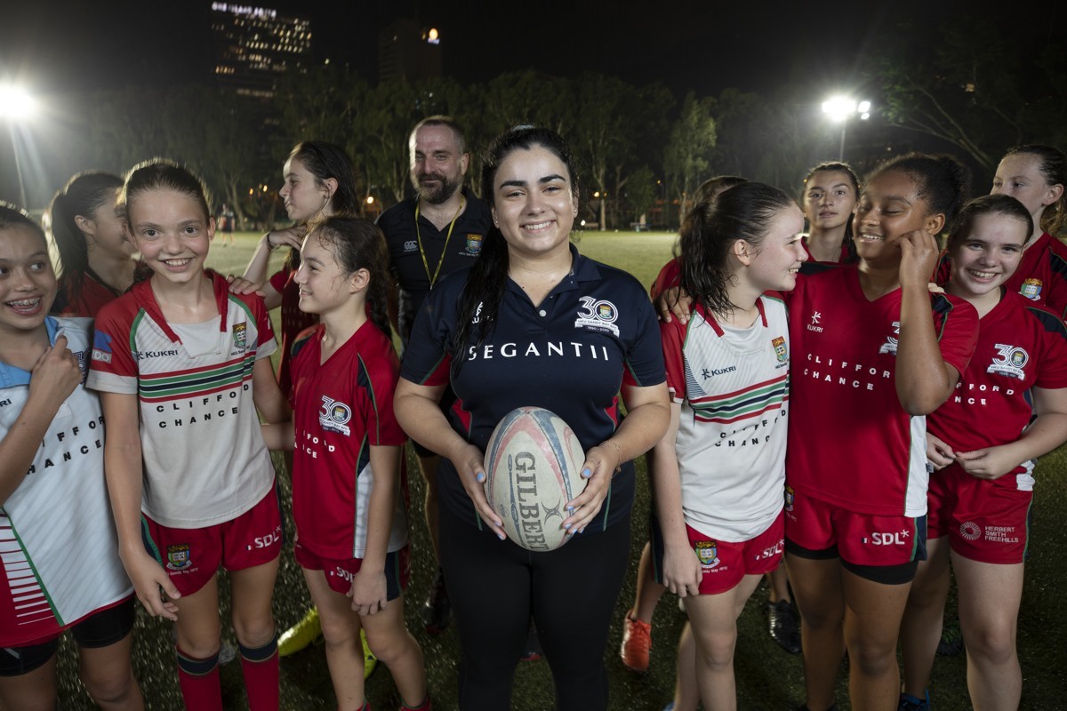Sandy Bay girl's rugby U14 coach Tanya Dhar trains the team at Wong Chuk Hang, Hong Kong.